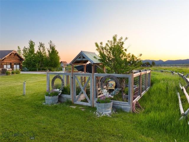 1400 Cottontail Rd, Gallatin Gateway, MT 59730 - yard at dusk featuring a lawn