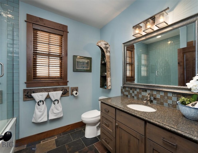 1400 Cottontail Rd, Gallatin Gateway, MT 59730 - bathroom featuring a shower with door, vanity, and stone finish floors