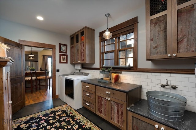 1400 Cottontail Rd, Gallatin Gateway, MT 59730 - kitchen featuring separate washer and dryer, dark countertops, tasteful backsplash, and pendant lighting