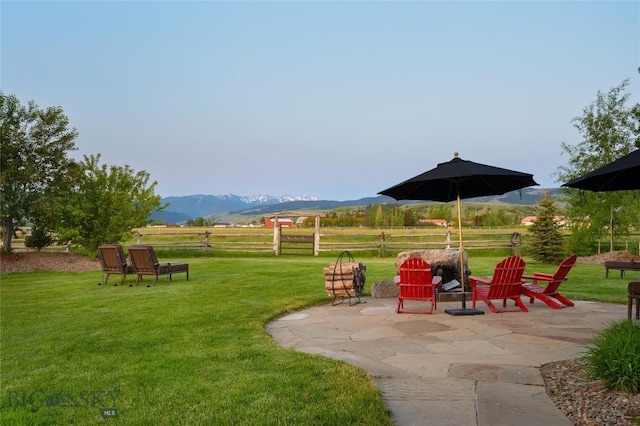 1400 Cottontail Rd, Gallatin Gateway, MT 59730 - view of grassy yard featuring a patio and a mountain view