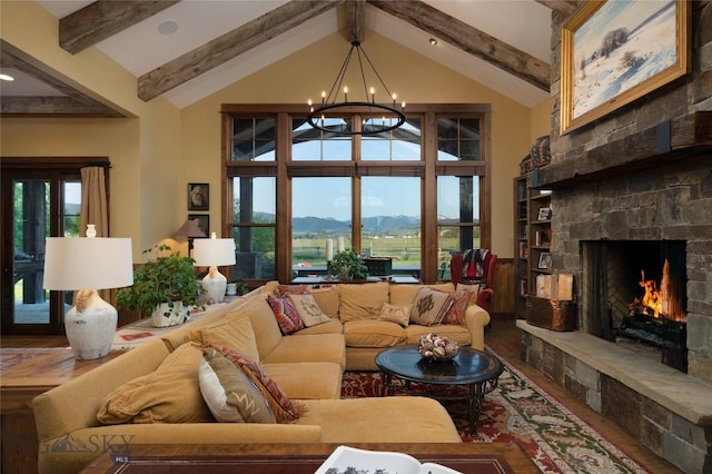 1400 Cottontail Rd, Gallatin Gateway, MT 59730 - living room with wood finished floors, a mountain view, a chandelier, beam ceiling, and a fireplace