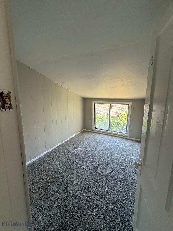 1717 Lowell, Butte, MT 59701 - carpeted empty room featuring baseboards