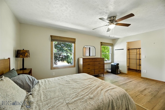 11 N Yellowstone Ave, Bozeman, MT 59718 - bedroom with wood finished floors, a textured ceiling, and ceiling fan