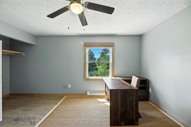 11 N Yellowstone Ave, Bozeman, MT 59718 - unfurnished office with a baseboard radiator, a textured ceiling, and a ceiling fan