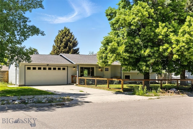 11 N Yellowstone Ave, Bozeman, MT 59718 - single story home with an attached garage, driveway, and roof with shingles