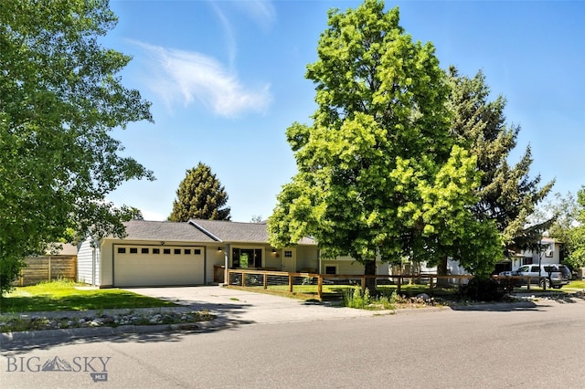 11 N Yellowstone Ave, Bozeman, MT 59718 - view of front of home with an attached garage and driveway