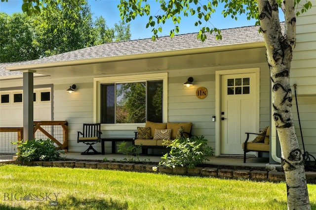 11 N Yellowstone Ave, Bozeman, MT 59718 - view of exterior entry with covered porch, roof with shingles, and a yard