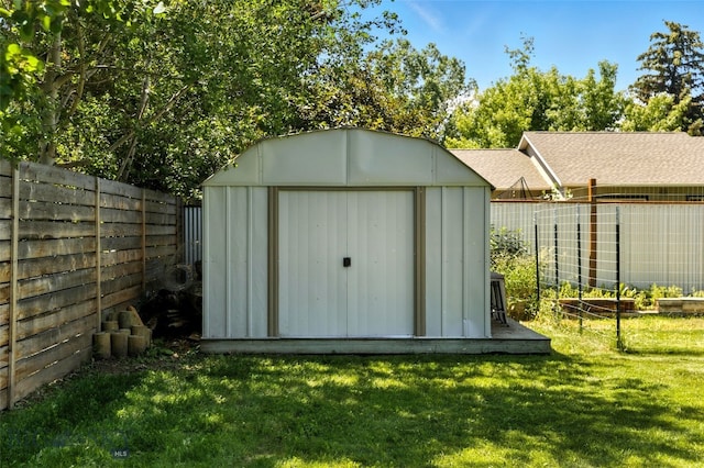 11 N Yellowstone Ave, Bozeman, MT 59718 - view of shed with a fenced backyard and a vegetable garden