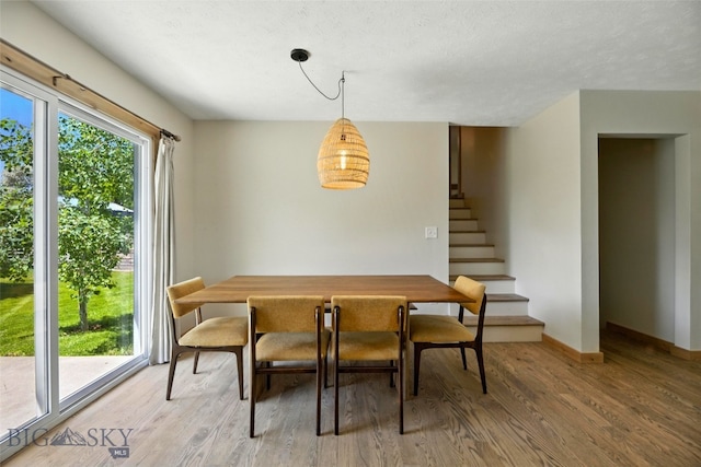 11 N Yellowstone Ave, Bozeman, MT 59718 - dining area featuring stairway and light wood-type flooring