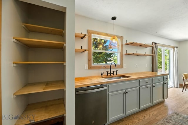 11 N Yellowstone Ave, Bozeman, MT 59718 - kitchen featuring dishwasher, wooden counters, open shelves, and light wood finished floors
