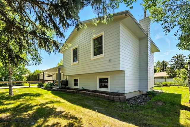 11 N Yellowstone Ave, Bozeman, MT 59718 - rear view of property featuring a chimney and an attached garage