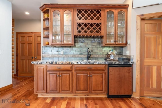 11540 Taiga Trl, Bozeman, MT 59715 - indoor wet bar with backsplash, light wood-type flooring, and recessed lighting