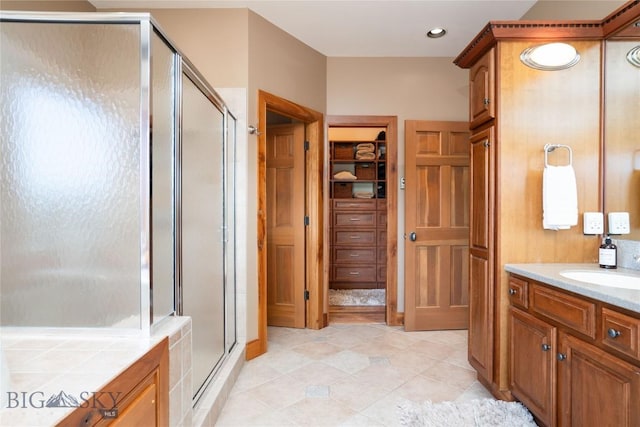11540 Taiga Trl, Bozeman, MT 59715 - full bathroom featuring a shower stall, vanity, a closet, tile patterned flooring, and recessed lighting