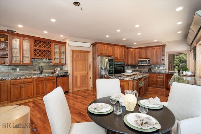 11540 Taiga Trl, Bozeman, MT 59715 - dining space featuring recessed lighting, bar with sink, and light wood finished floors