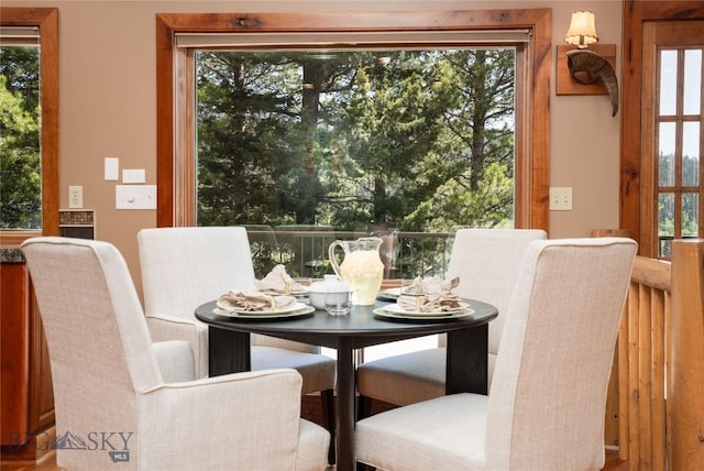 11540 Taiga Trl, Bozeman, MT 59715 - dining room with healthy amount of natural light and wood finished floors