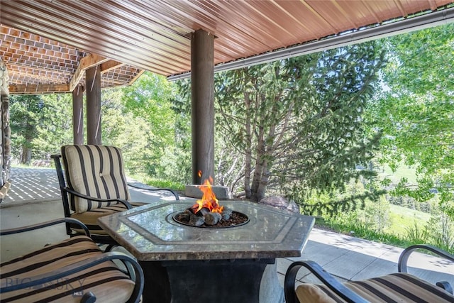 11540 Taiga Trl, Bozeman, MT 59715 - view of patio featuring an outdoor fire pit