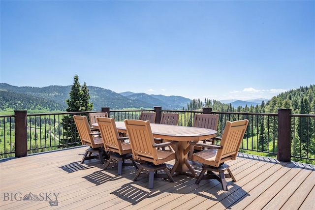11540 Taiga Trl, Bozeman, MT 59715 - wooden terrace featuring a mountain view and outdoor dining space