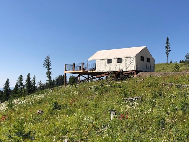 11540 Taiga Trl, Bozeman, MT 59715 - back of house featuring an outdoor structure and board and batten siding