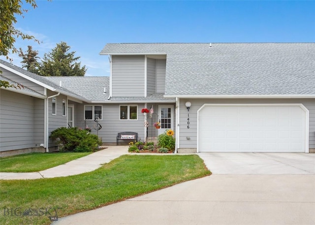 1406 Gilman Ave, Butte, MT 59701 - view of front of house featuring a garage, concrete driveway, roof with shingles, and a front yard
