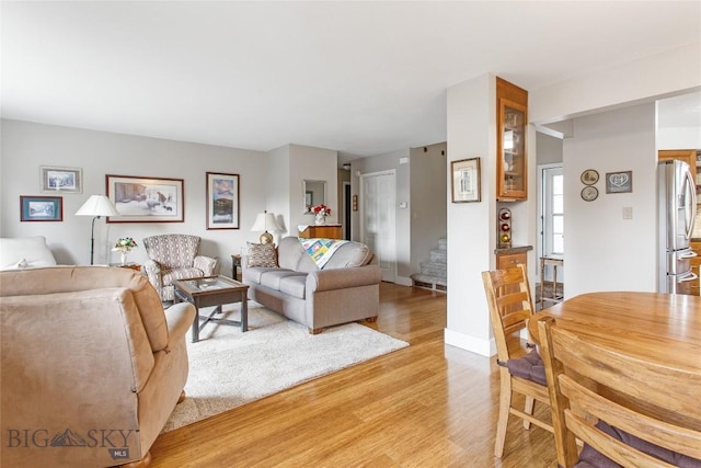 1406 Gilman Ave, Butte, MT 59701 - living room with light wood-style floors and stairway