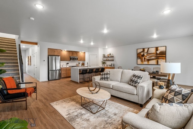 402 W Manhattan Ave Unit B, Manhattan, MT 59741 - living area featuring stairway, light wood-type flooring, and recessed lighting