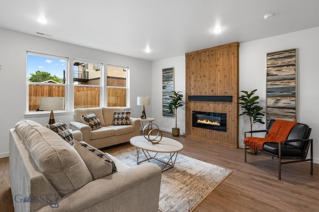 402 W Manhattan Ave Unit B, Manhattan, MT 59741 - living area featuring wood finished floors, a large fireplace, and recessed lighting