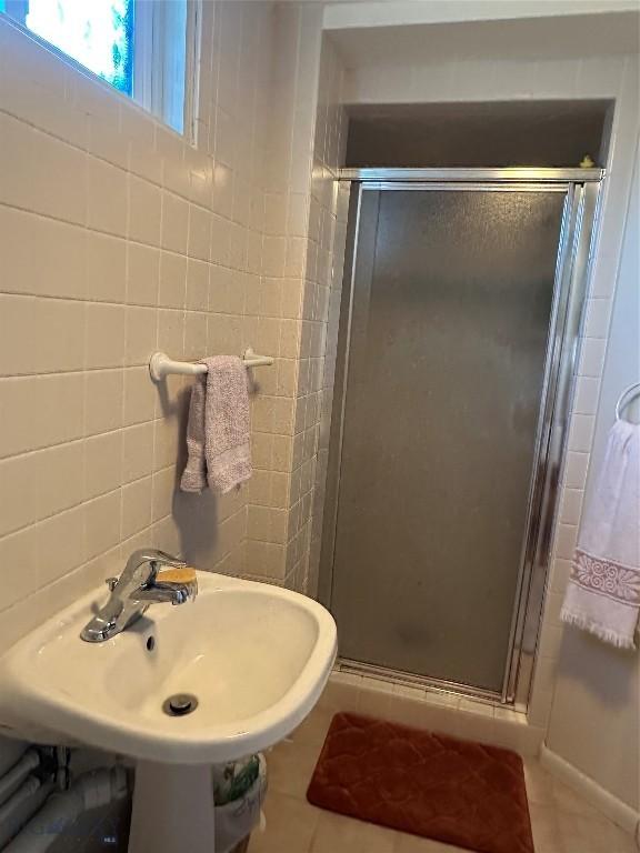 1914 Haggin, Anaconda, MT 59711 - bathroom with tile patterned floors, a stall shower, and tile walls