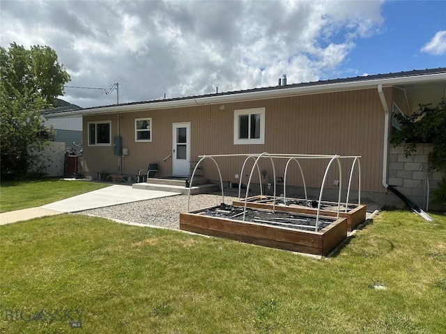 1914 Haggin, Anaconda, MT 59711 - rear view of property with a garden and a lawn