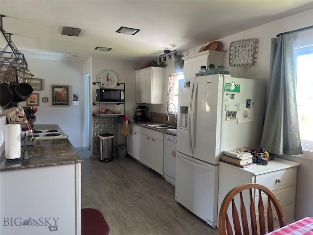 1914 Haggin, Anaconda, MT 59711 - kitchen with white appliances, white cabinetry, dark countertops, and wood finished floors