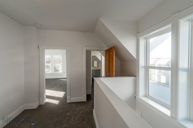 416 N 3rd St, Livingston, MT 59047 - hall with dark colored carpet and an upstairs landing