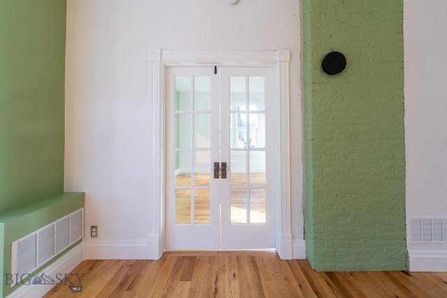 416 N 3rd St, Livingston, MT 59047 - doorway to outside with french doors and light wood-style flooring