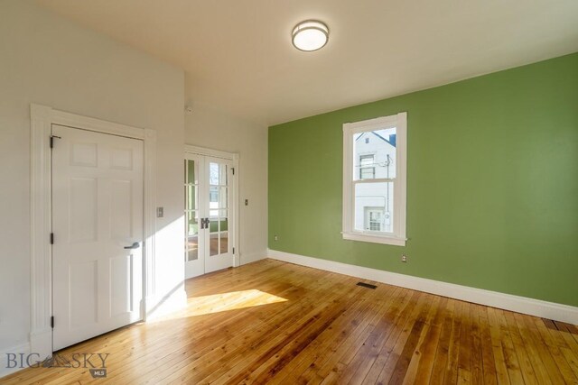 416 N 3rd St, Livingston, MT 59047 - unfurnished room with hardwood / wood-style flooring, french doors, and healthy amount of natural light