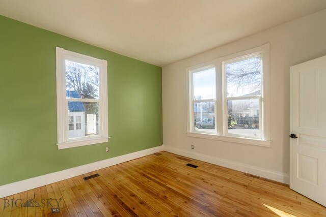 416 N 3rd St, Livingston, MT 59047 - unfurnished room with baseboards and hardwood / wood-style floors
