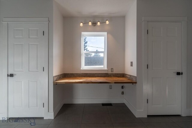 416 N 3rd St, Livingston, MT 59047 - bathroom with tile patterned flooring and baseboards