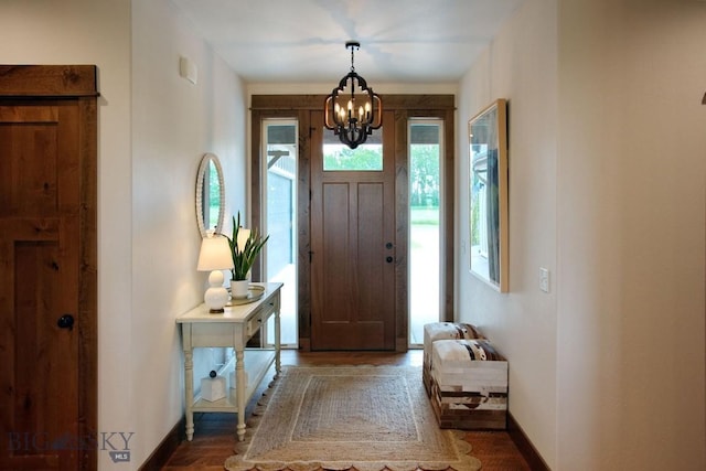 243 Tinkers Ln, Bozeman, MT 59718 - entrance foyer featuring a chandelier and wood finished floors