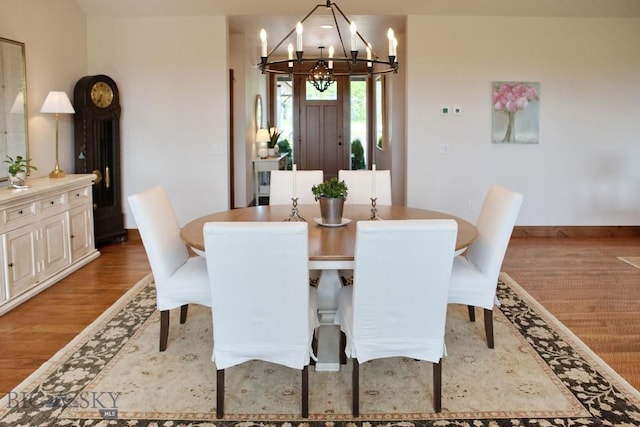 243 Tinkers Ln, Bozeman, MT 59718 - dining area featuring a chandelier and wood finished floors