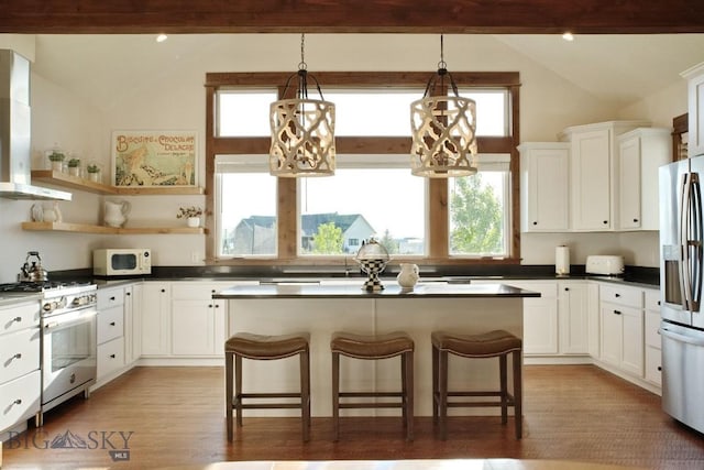 243 Tinkers Ln, Bozeman, MT 59718 - kitchen with white appliances, plenty of natural light, and white cabinetry