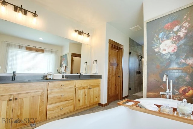 243 Tinkers Ln, Bozeman, MT 59718 - full bath featuring a freestanding bath, a stall shower, double vanity, and tile patterned flooring