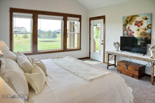 243 Tinkers Ln, Bozeman, MT 59718 - bedroom featuring vaulted ceiling, light carpet, and access to outside