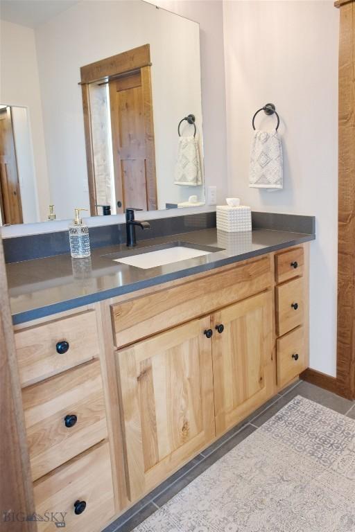 243 Tinkers Ln, Bozeman, MT 59718 - bathroom with vanity and tile patterned floors