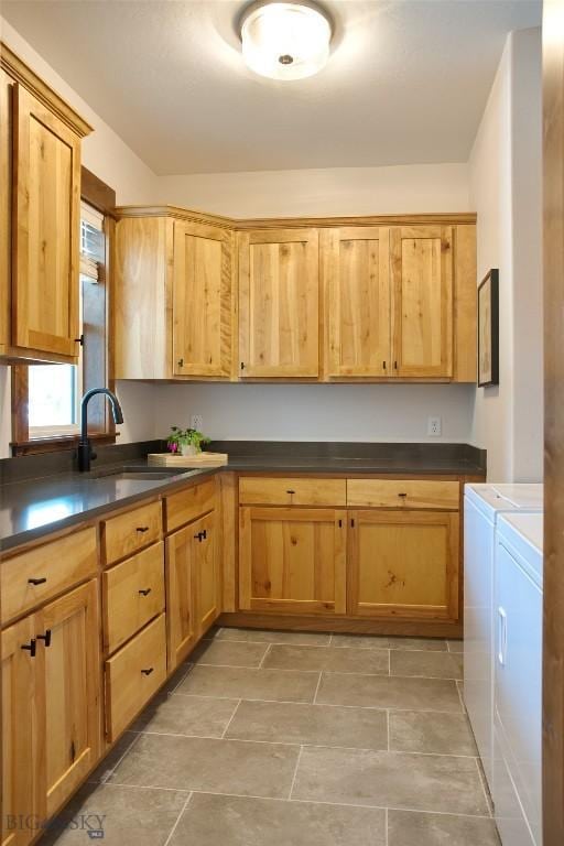243 Tinkers Ln, Bozeman, MT 59718 - kitchen featuring washing machine and dryer and dark countertops