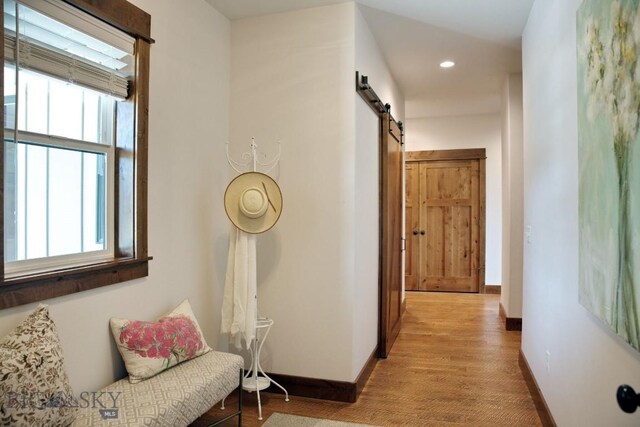 243 Tinkers Ln, Bozeman, MT 59718 - corridor with a barn door and recessed lighting