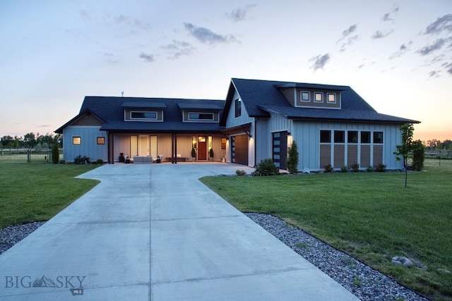 243 Tinkers Ln, Bozeman, MT 59718 - view of front of home featuring driveway, board and batten siding, a porch, and a shingled roof
