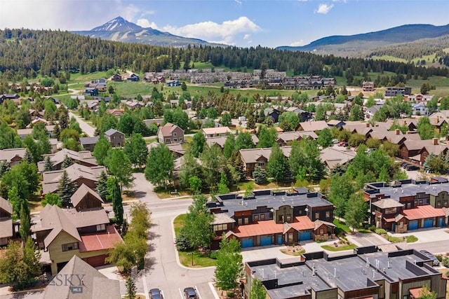 99 Pheasant Tail Ln Unit 1, Big Sky, MT 59716 - aerial view of residential area with a forest and mountains