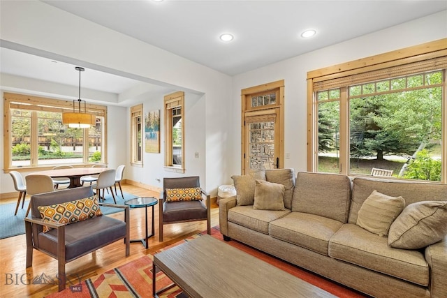 99 Pheasant Tail Ln Unit 1, Big Sky, MT 59716 - living room featuring plenty of natural light, recessed lighting, and light wood-style floors