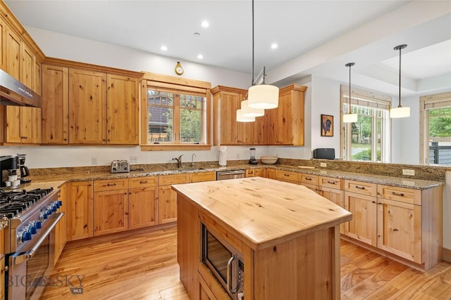99 Pheasant Tail Ln Unit 1, Big Sky, MT 59716 - kitchen featuring butcher block countertops, appliances with stainless steel finishes, a peninsula, light wood-style floors, and recessed lighting