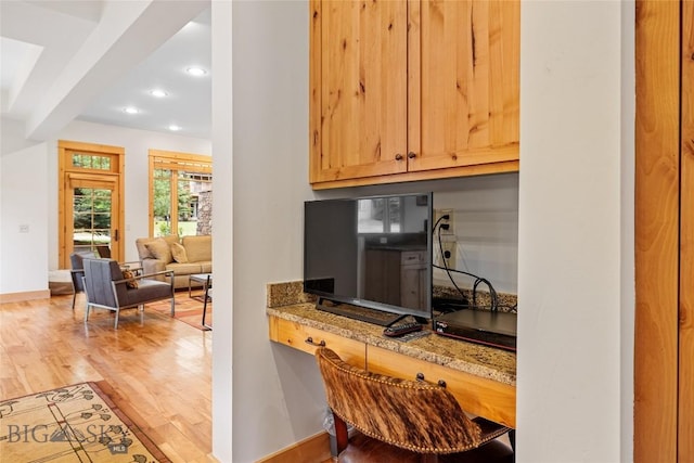 99 Pheasant Tail Ln Unit 1, Big Sky, MT 59716 - kitchen featuring light wood finished floors, recessed lighting, and light stone countertops