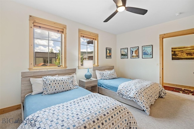 99 Pheasant Tail Ln Unit 1, Big Sky, MT 59716 - carpeted bedroom featuring baseboards and a ceiling fan