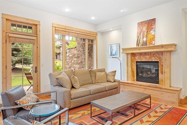 99 Pheasant Tail Ln Unit 1, Big Sky, MT 59716 - living room with recessed lighting, a high end fireplace, and wood finished floors