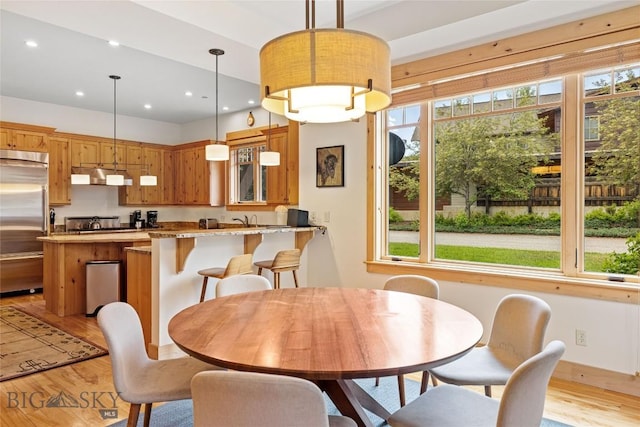 99 Pheasant Tail Ln Unit 1, Big Sky, MT 59716 - dining space featuring plenty of natural light, light wood-style floors, and recessed lighting